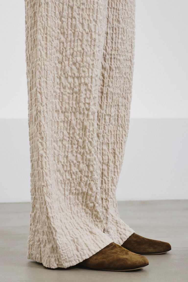 Trousers in embossed micro-herringbone cotton