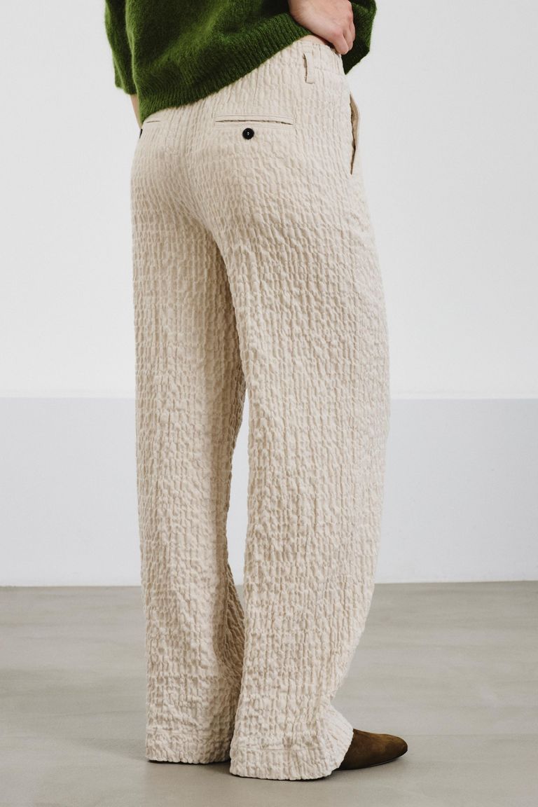 Trousers in embossed micro-herringbone cotton